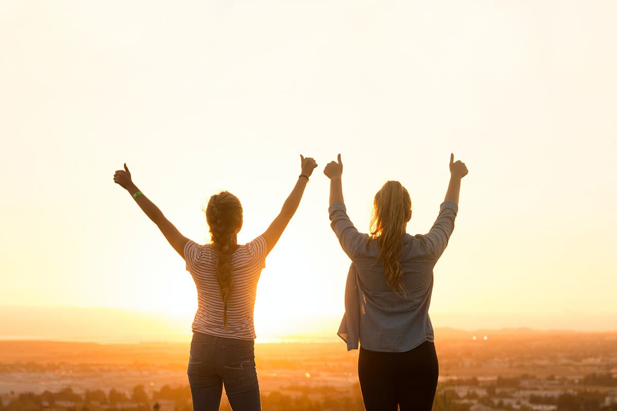 Two Friends Enjoy a Sunrise