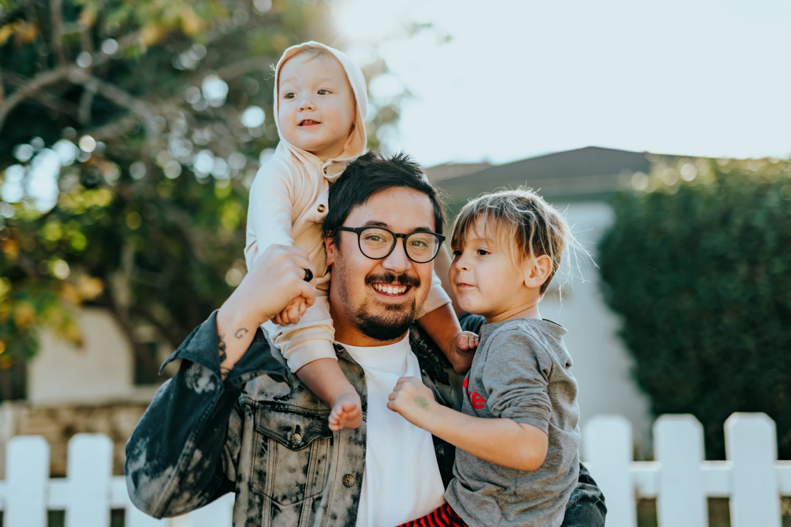 Dad with 2 kids smiling
