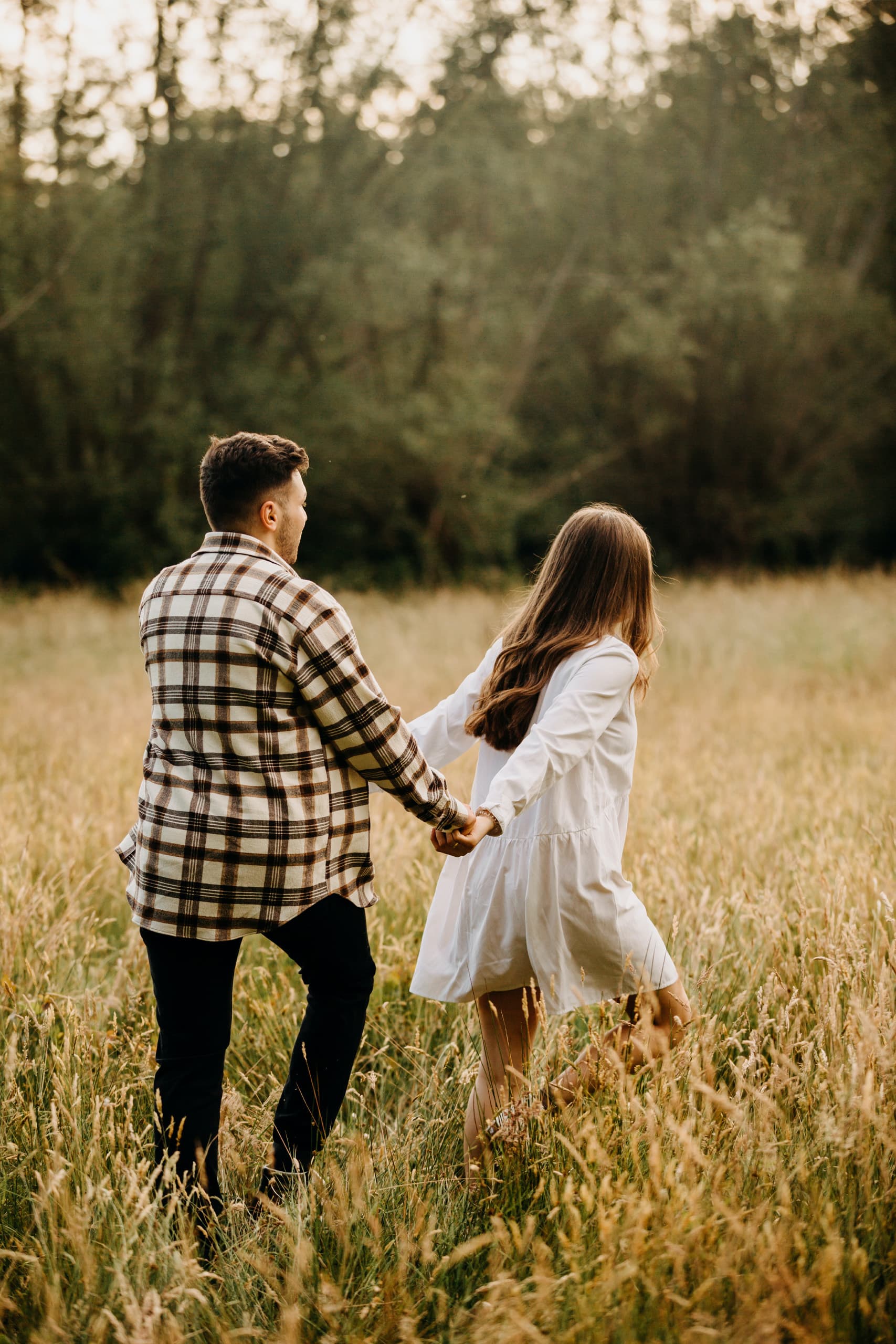 Premarital counseling page with text on the left and a couple holding hands in a field on the right