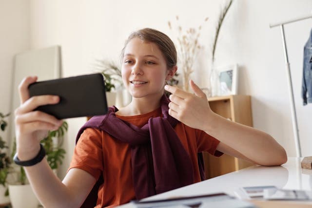 Teenage girl looking at her phone