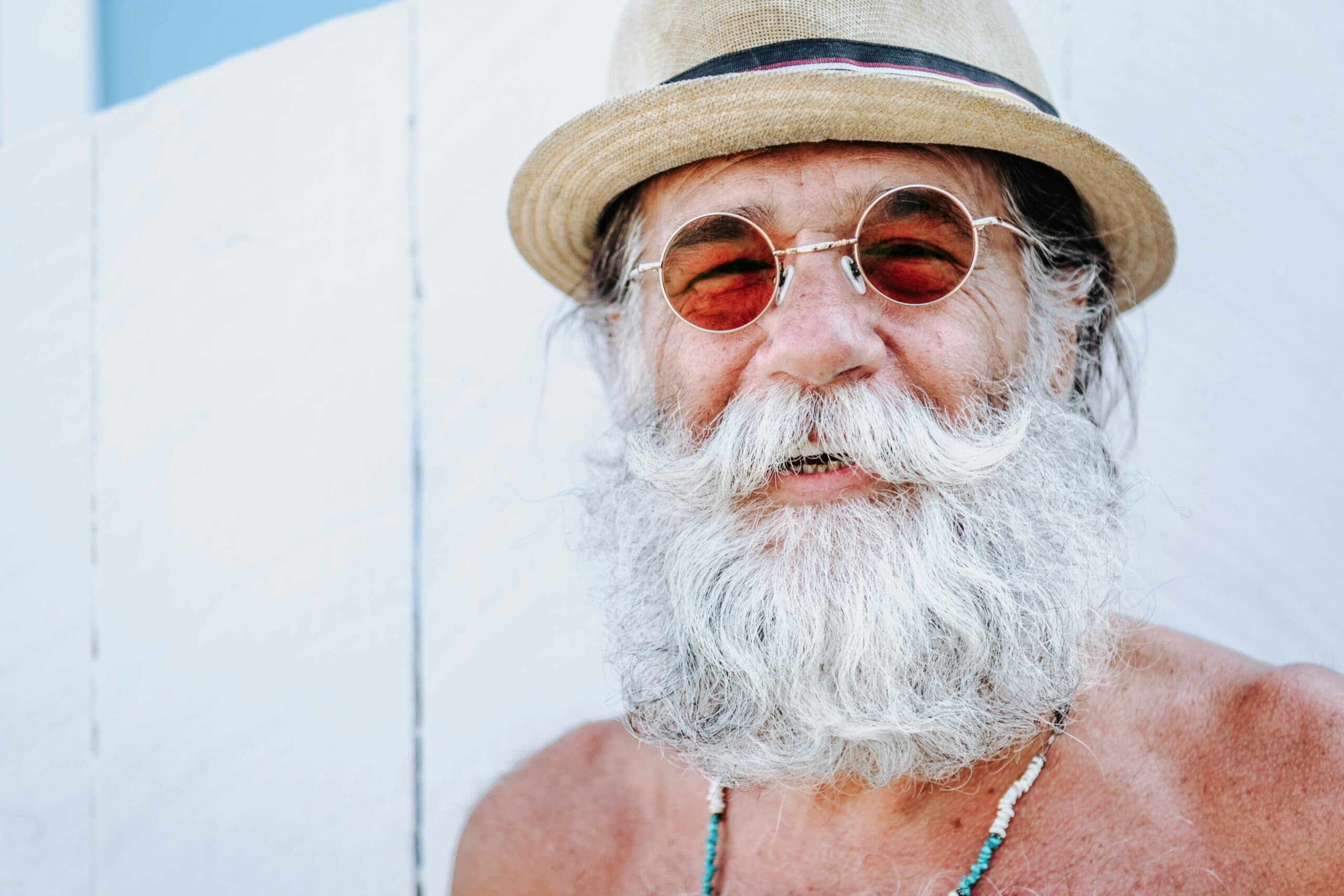 A smiling man with a gray beard.