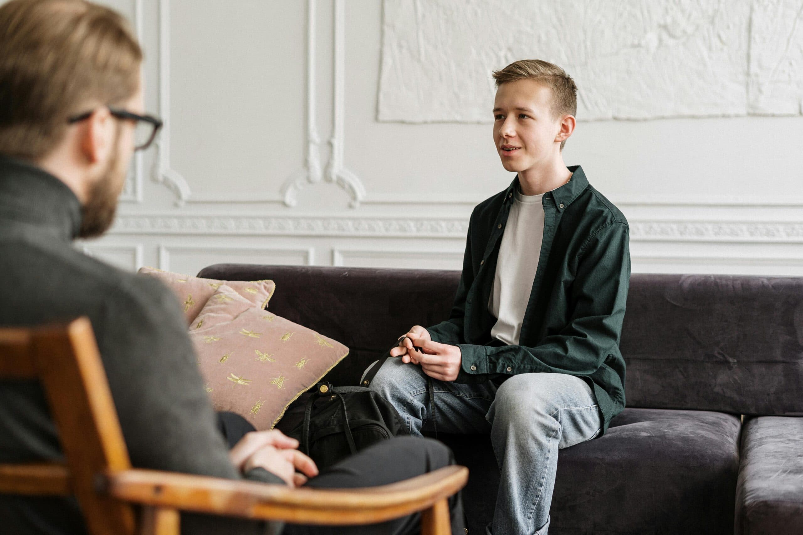 a teenager in therapy discussing the impact of childhood neglect