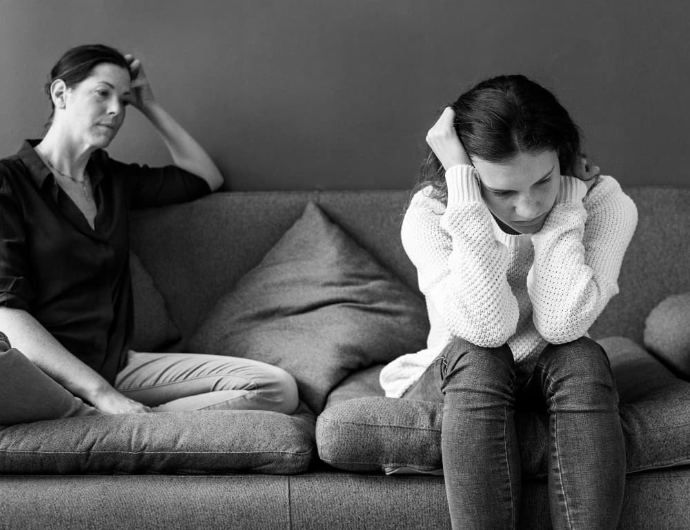 Woman trying to spot the early signs of substance abuse in a family member
