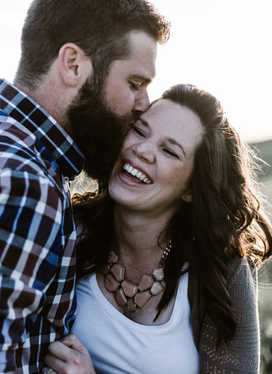 Premarital counseling page with text on the left and a couple holding hands in a field on the right